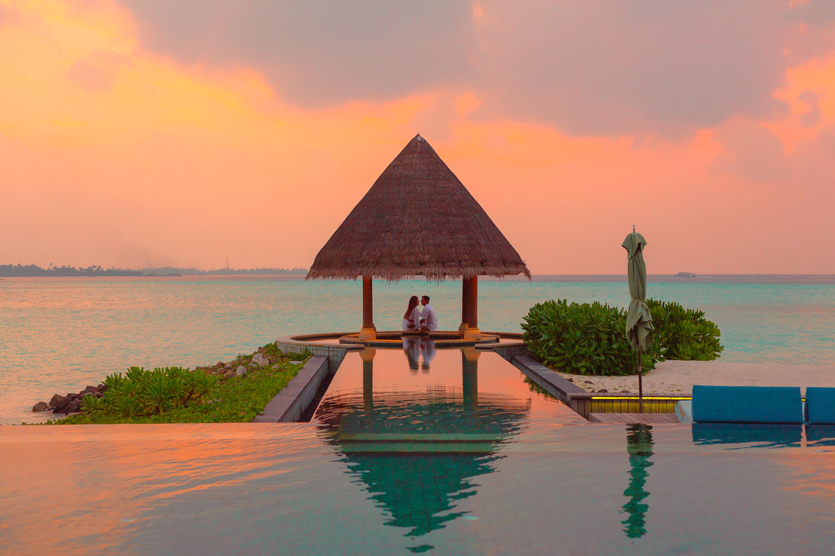 couple-under-hut-beside-sea-and-infinity-pool-1024967.jpg