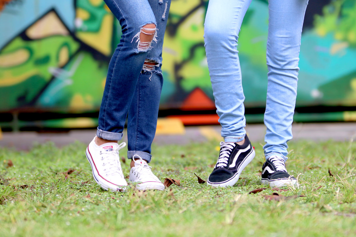 person-s-wearing-white-and-black-low-top-sneakers-981619.jpg