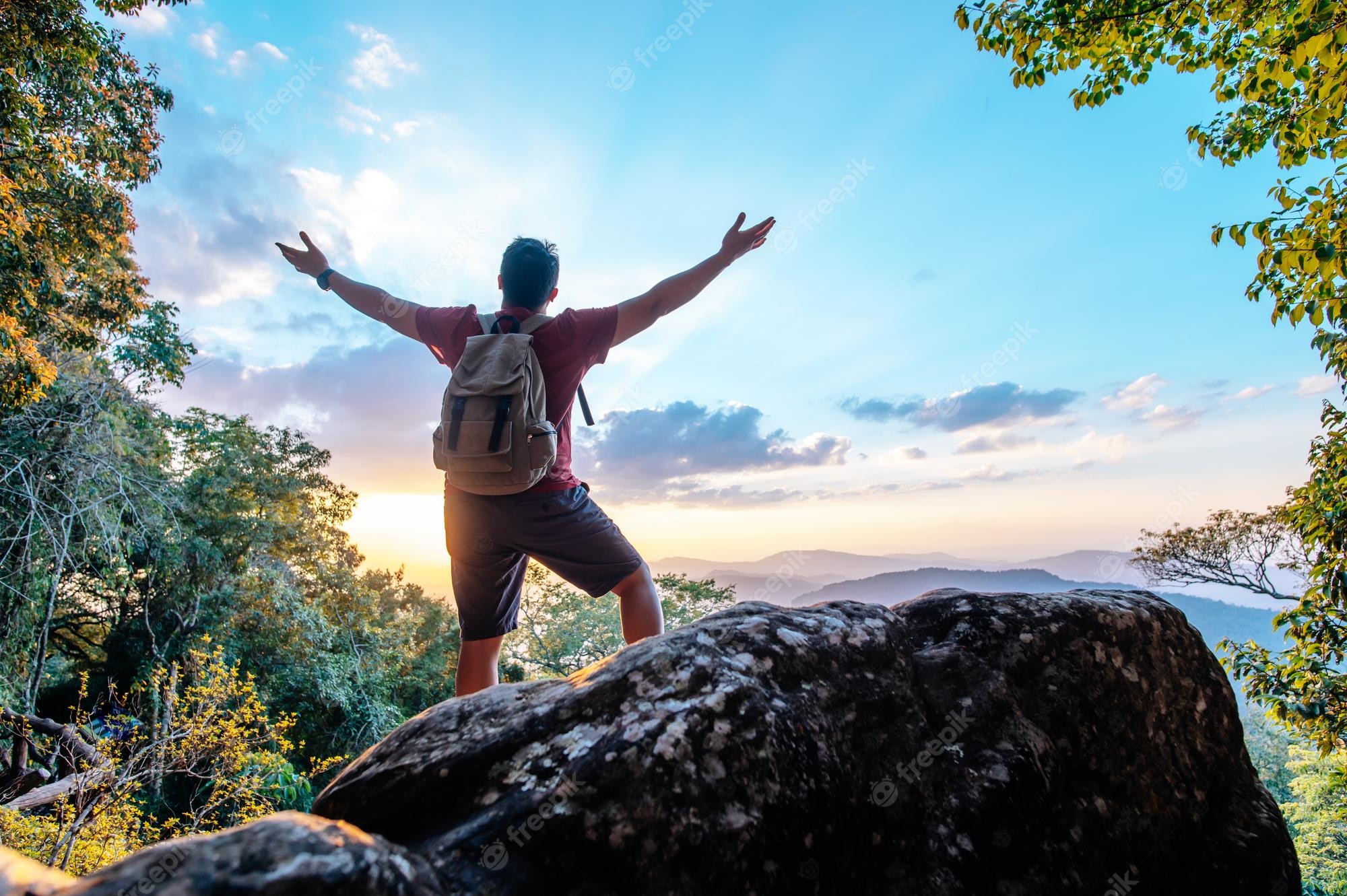 rear-view-back-young-asian-hiking-man-standing-riseup-hands-with-happy-peak-rocky-mountain-copy-space_1150-57186.jpg